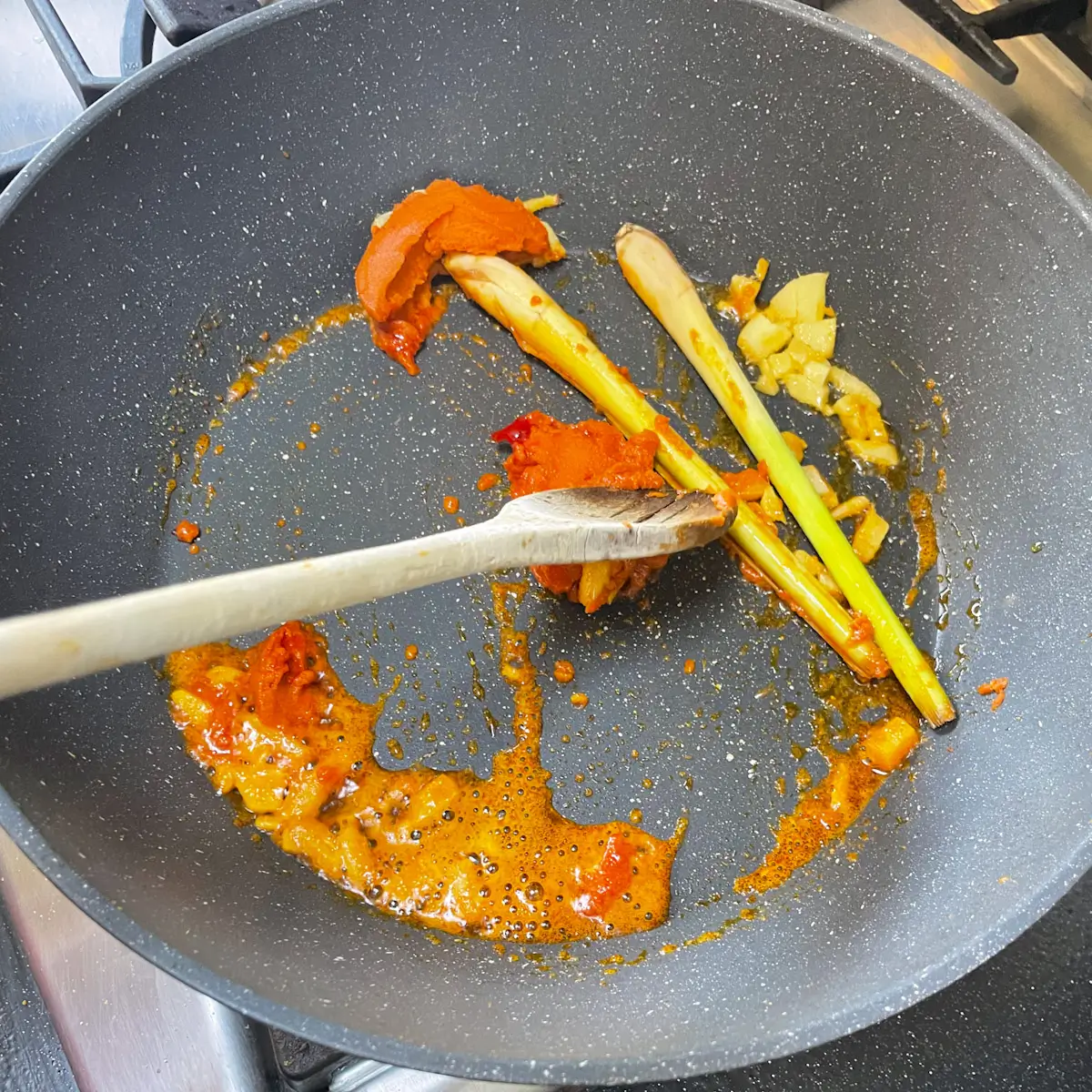 cooking the ginger lemongrass and red curry paste