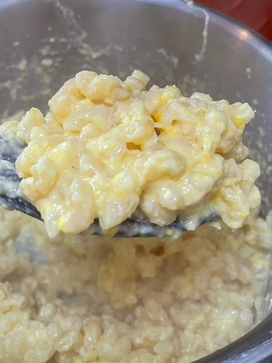 creamy sweetcorn pasta on a serving spoon