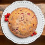 overhead image of a wild strawberry and polenta cake