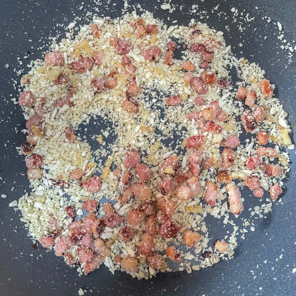 making crispy breadcrumbs with pancetta and garlic