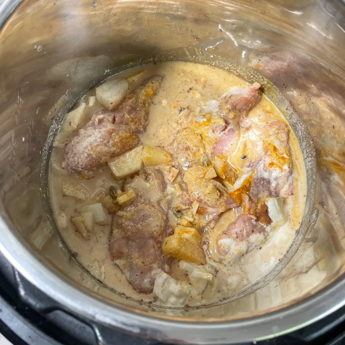 chicken thighs, ground almonds, yoghurt and all other ingredients added to a slow cooker