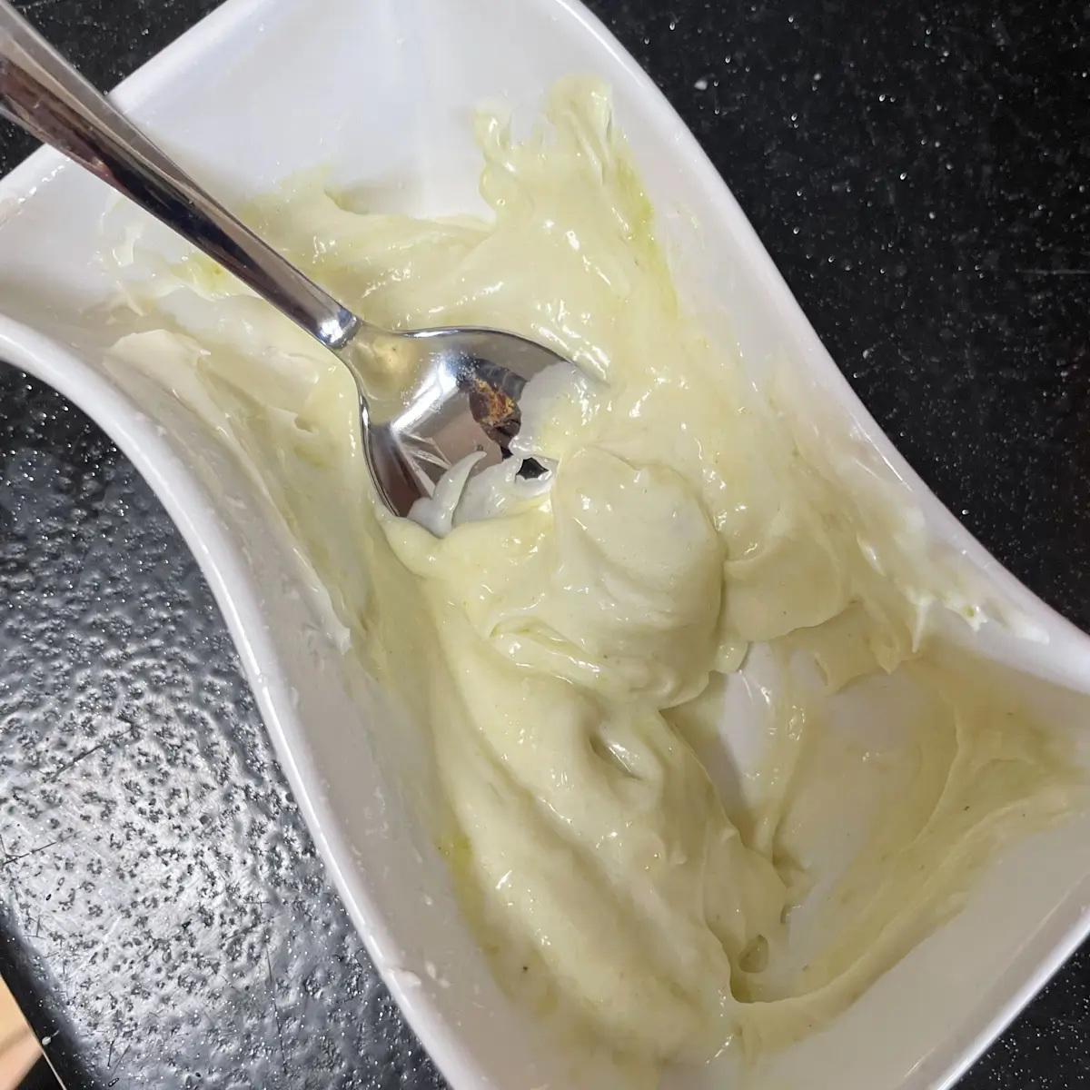 mixing wasabi and mayonnaise in a bowl