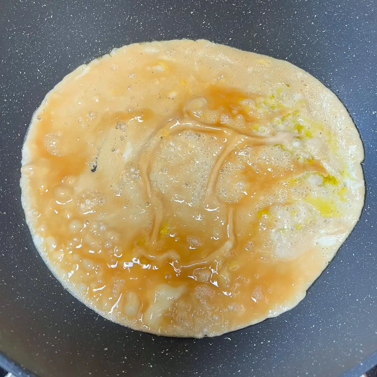 cooking Japanese style omelette in a pan
