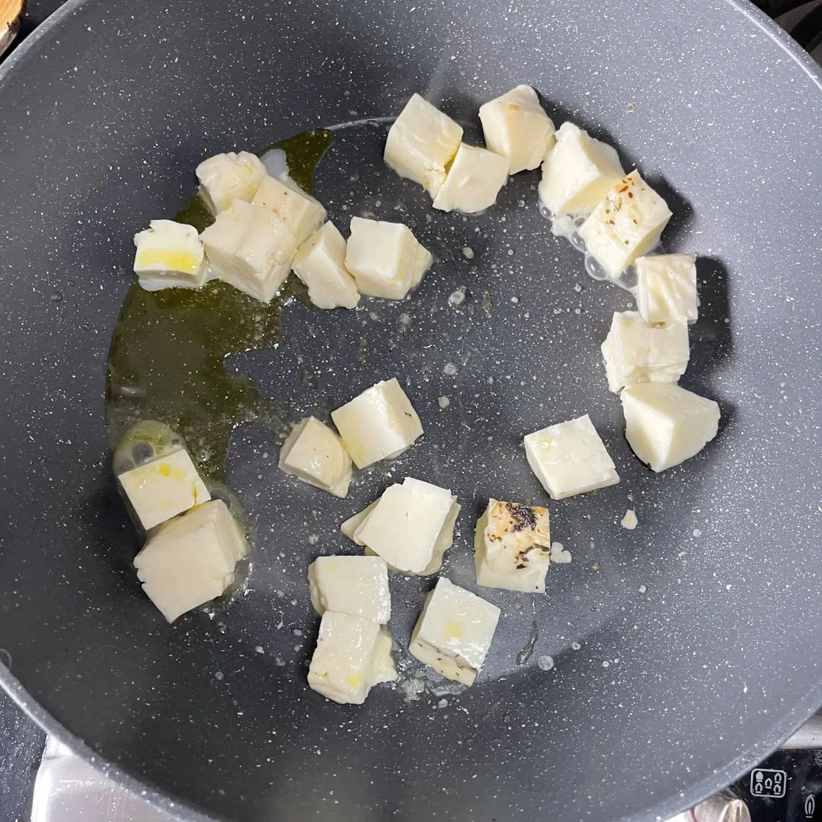 Cooking halloumi in a pan until golden